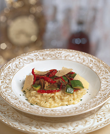 MUSHROOM RISOTTO WITH COURGETTES, SUN BLUSHED TOMATOES AND PARMESAN 